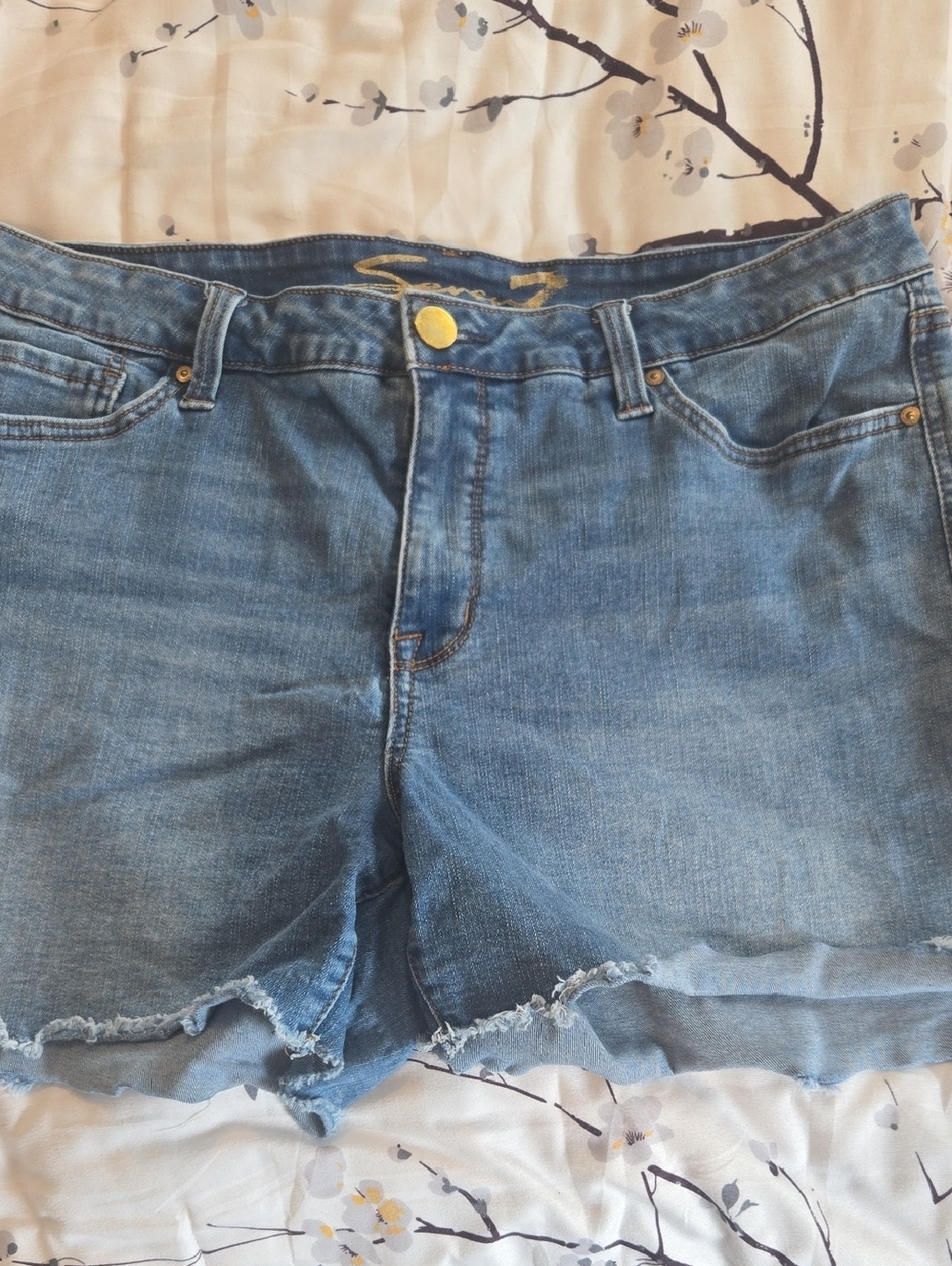 Women’s Light Blue Distressed Denim Shorts